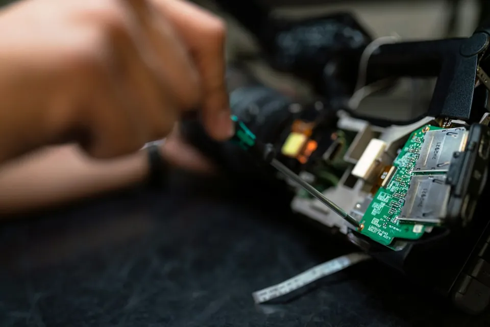 A technician installing a computer memory module